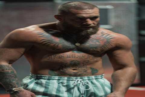 Conor McGregor shows off amazing strength doing weighted pull-ups as he prepares to start full..