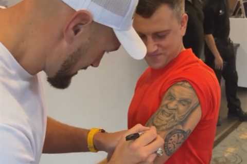 Tyson Fury signs MASSIVE tattoo of his face on superfan’s arm as Gypsy King gives Anthony Joshua..