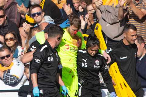 Barnsley star Brad Collins covered in blood after suffering horrific head gash which caused 14..