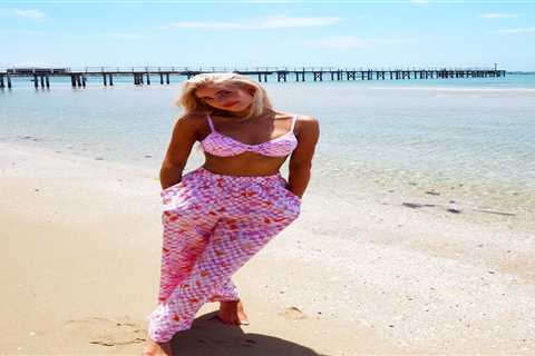 Morgan Riddle stuns in pink bra and trousers on the beach before Taylor Fritz’s Australian Open..